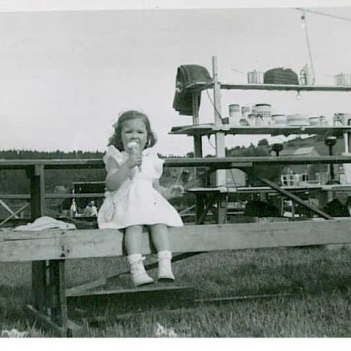 A young girl enjoying an ice cream at the Community Fair