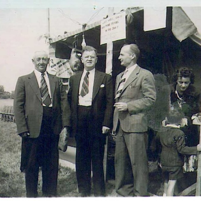 Fairgoers at a community booth