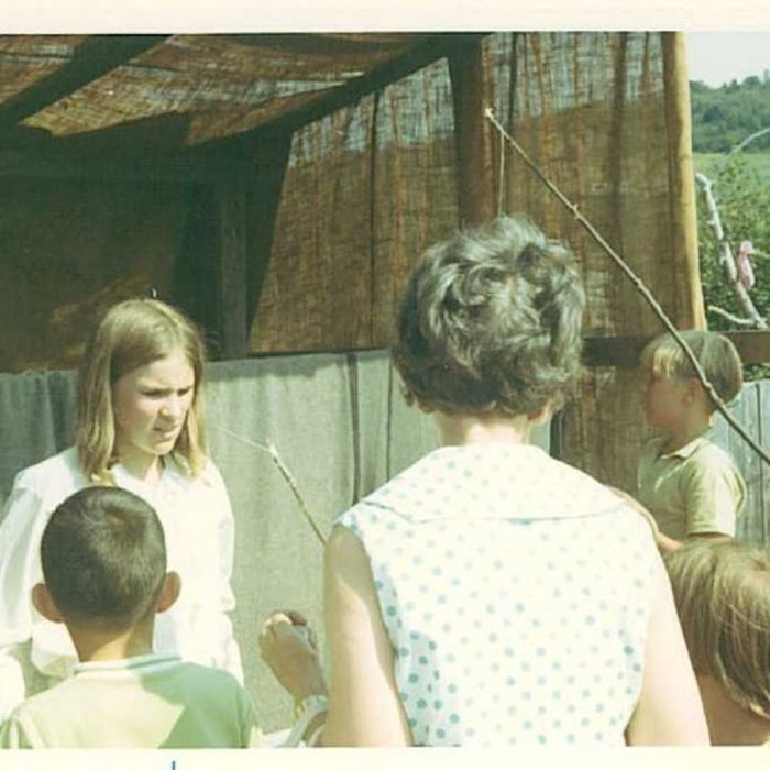 Children at a fishing game booth